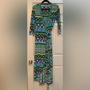 Very cute hi low wrap dress of polyester and spandex